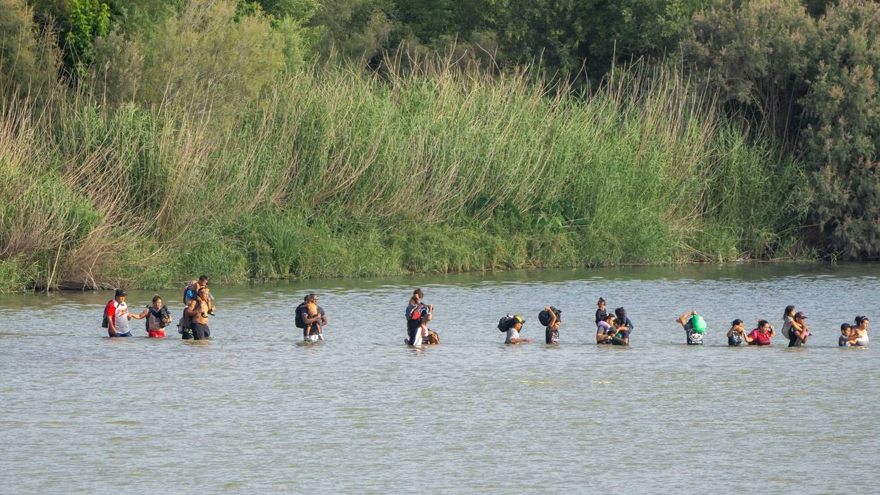 Migrants cross the Rio Grande from the Mexican side of the border towards the U.S. on July 16, 2023, as seen from Eagle Pass, Texas