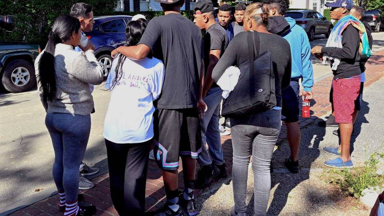 Migrants gather outside St. Andrews Episcopal Church last Thursday in Edgartown, Mass., on Martha's Vineyard.