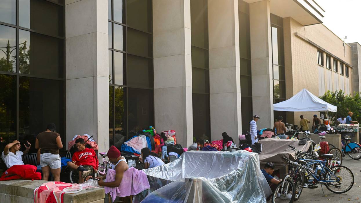 Migrants living at the Chicago Police Department