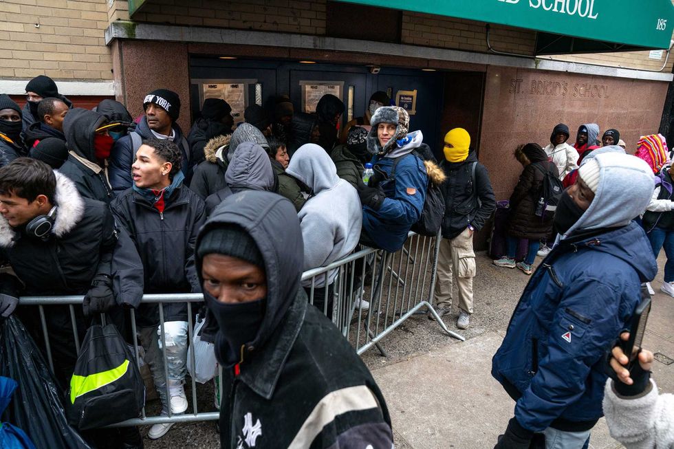 Migrants seek shelter at the NYPD