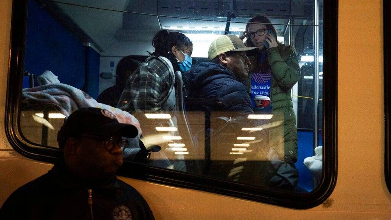 Migrants sent by Texas Gov. Greg Abbott arrive near 30th Street Station Wednesday morning, Nov. 16, 2022, in Philadelphia. (AP Photo/Joe Lamberti)