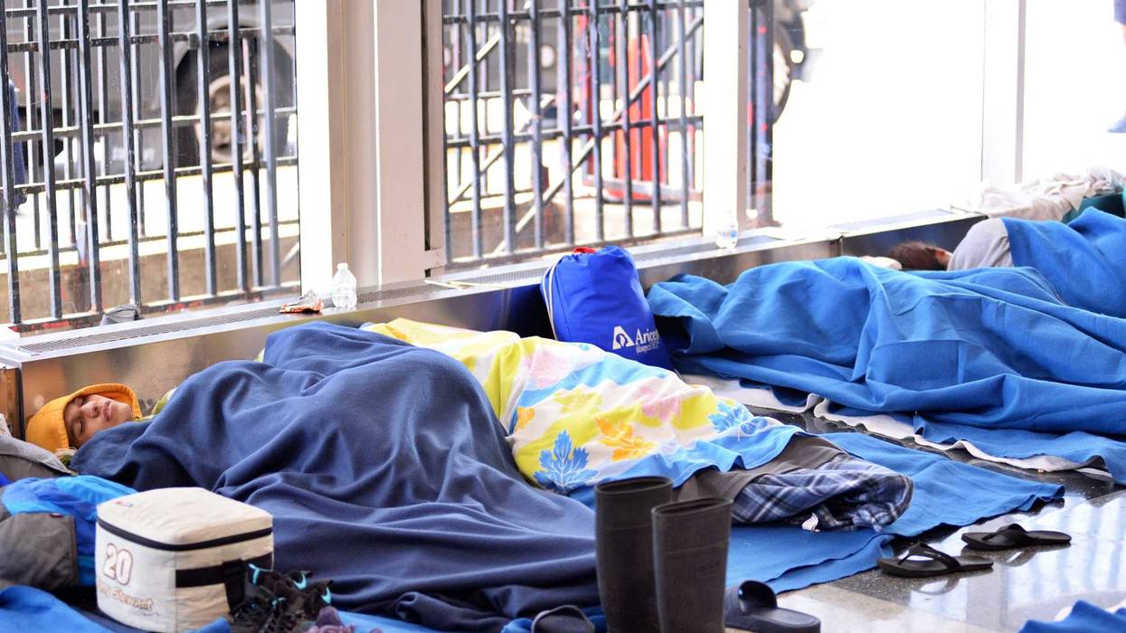 migrants sleeping at O'Hare International Airport