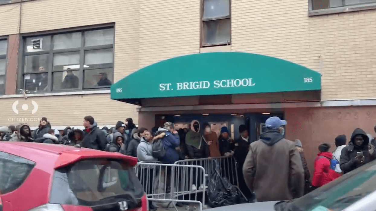 Migrants waiting outside of an intake center in the East Village on Saturday morning.