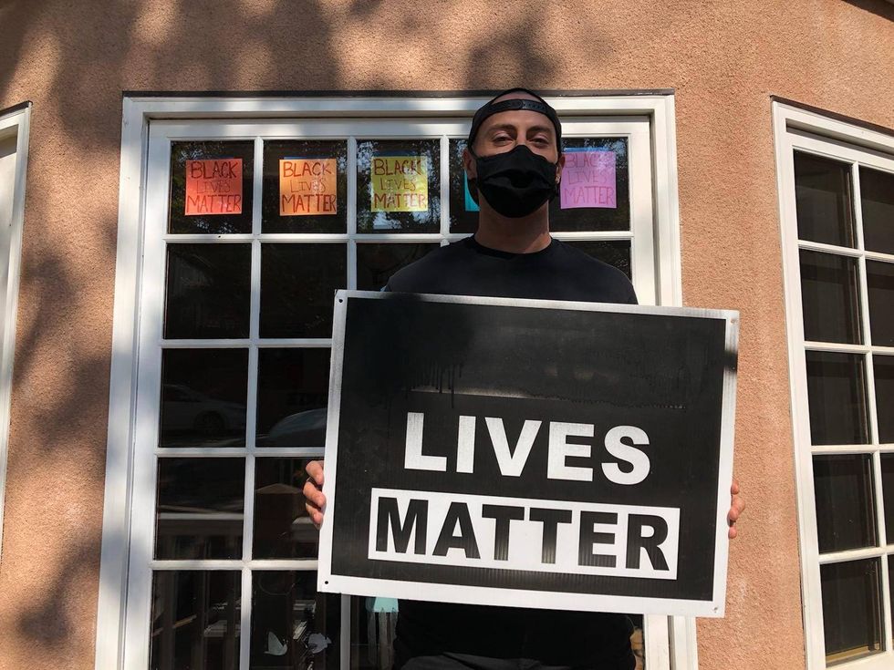 Mike Cvet of Piedmont holds one of his vandalized Black Lives Matter signs.