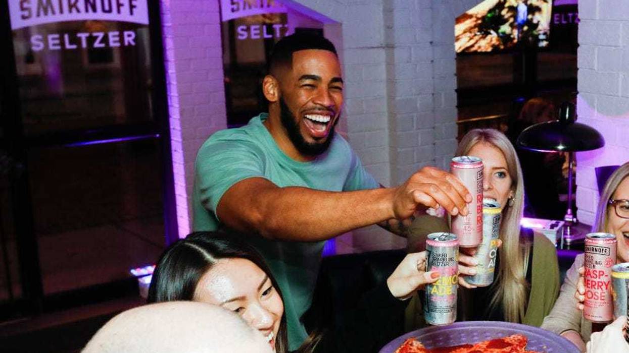 Mike Johnson and fans toast to the end of an amazing Bachelor season with Smirnoff Seltzer Rosés, which are “The Official Hard Seltzer of The Bachelor” on March 10, 2020 in Chicago, Illinois. (Photo by Jeff Schear/Getty Images for Smirnoff)