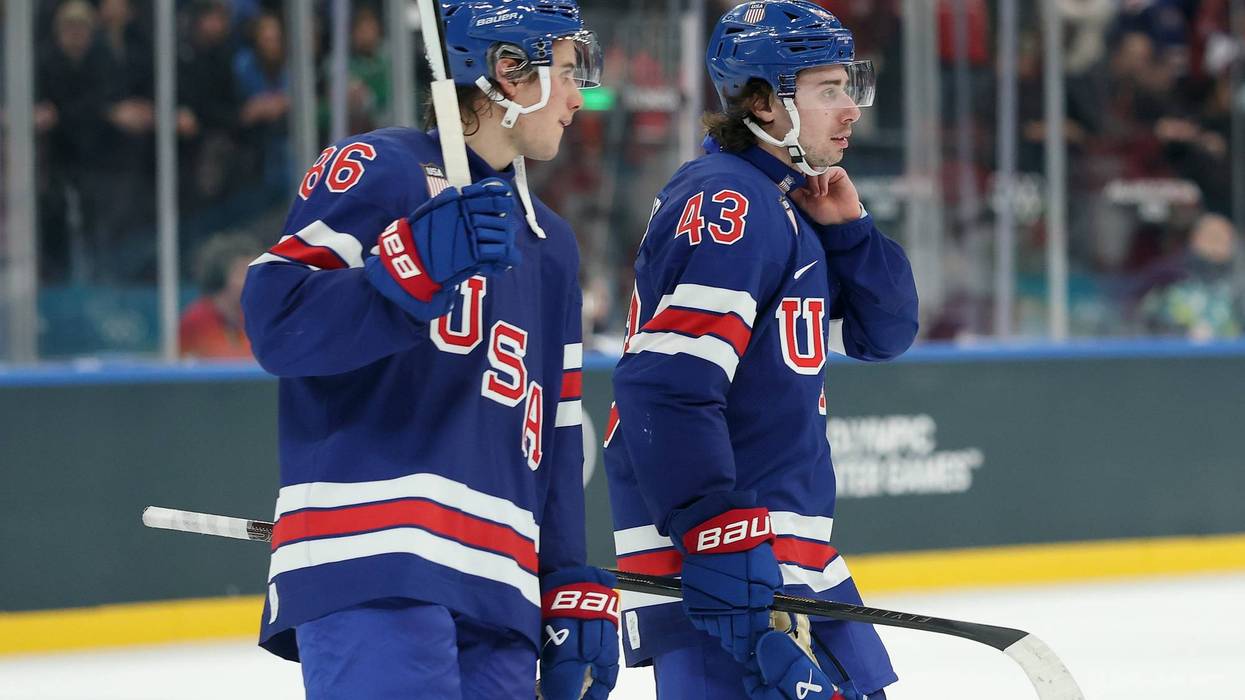 MILAN, ITALY - FEBRUARY 14: Jack Hughes #86 and Quinn Hughes #43 of Team United States celebrate after the victory in the Men's Preliminary Group C match between the United States and Denmark on day eight of the Milano Cortina 2026 Winter Olympic games at Milano Santagiulia Ice Hockey Arena on February 14, 2026 in Milan, Italy.