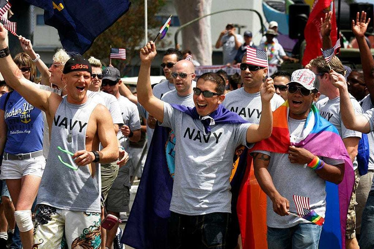 Military personnel march down University Avenue during the San Diego gay pride parade.