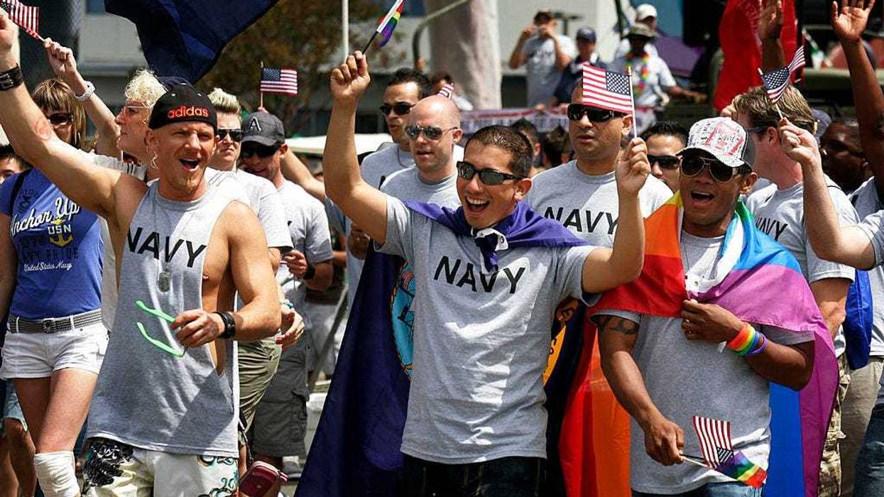 Military personnel march down University Avenue during the San Diego gay pride parade.
