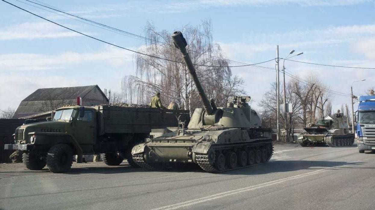 Military vehicles are seen along a street on February 25, 2022 in Kyiv, Ukraine.