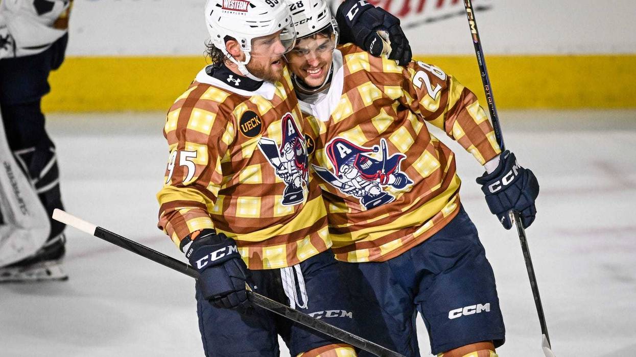 Milwaukee Admirals forward Grigori Denisenko (28) celebrates his goal against the Chicago Wolves with teammate Chase De Leo (95) in a game Friday, April 18, 2025, at the UW-Milwaukee Panther Arena in Milwaukee, Wisconsin.