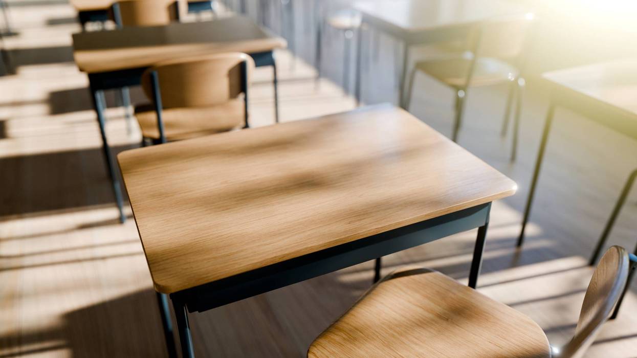 Minimalist Classroom Setting with Wooden Desks emphasizing a peaceful learning environment filled with natural light. 3d render.