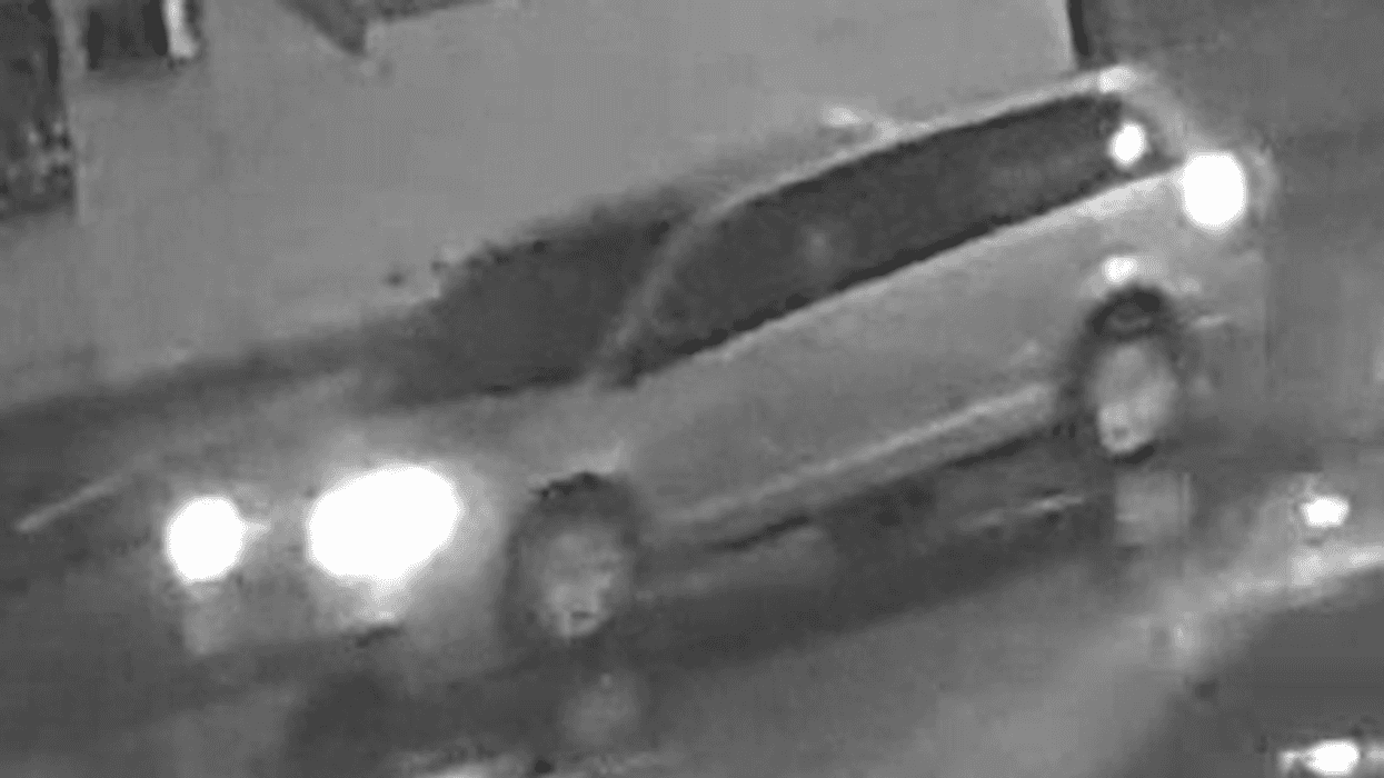 Minivan caught on black-and-white surveillance camera