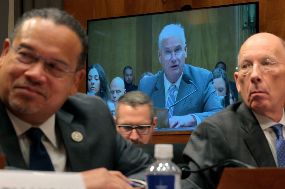 Minnesota Attorney General Keith Ellison (L) and Minnesota Department of Corrections Commissioner Paul Schnell (R) watch as House Majority Whip Tom Emmer (R-MN) testify before the Senate Homeland Security and Governmental Affairs Committee in the Dirksen Senate Office Building on February 12, 2026 in Washington, DC.