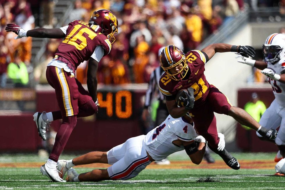 Minnesota Golden Gophers running back Grant Washington (21) runs the ball against the Northwestern State Demons during the third quarter at Huntington Bank Stadium.