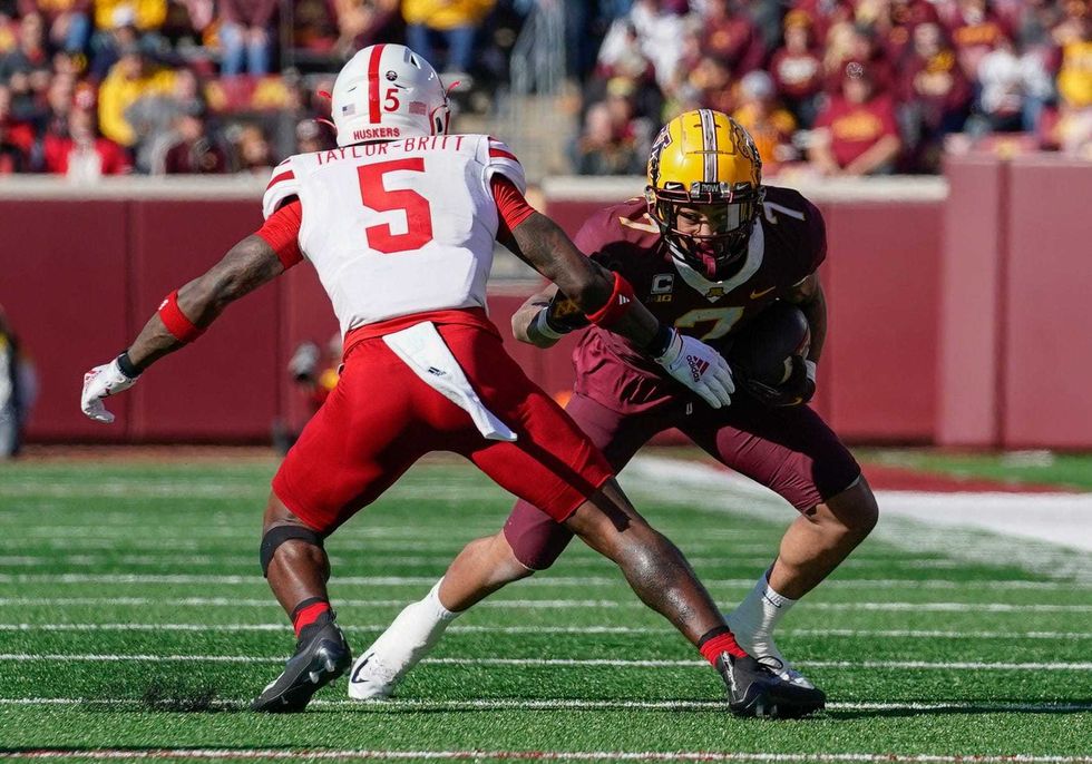 Minnesota Golden Gophers wide receiver Chris Autman-Bell (7) and Nebraska Cornhuskers linebacker Cam Taylor-Britt (5) at Huntington Bank Stadium.