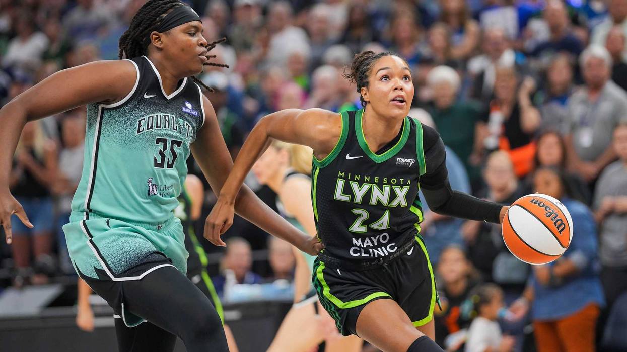 Minnesota Lynx forward Napheesa Collier (24) dribbles against New York Liberty center Jonquel Jones (35) in the first quarter at Target Center.