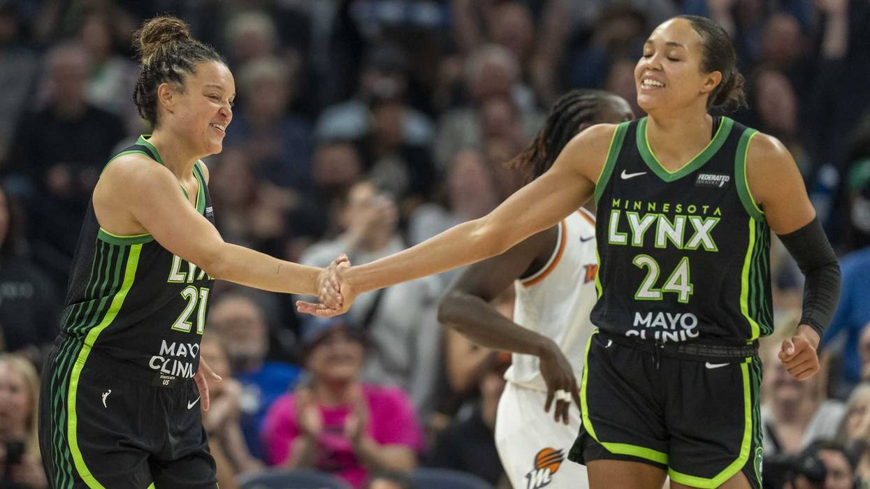 Minnesota Lynx guard Kayla McBride (21) celebrates with Minnesota Lynx forward Napheesa Collier (24) after making a shot against the Phoenix Mercury in the second half at Target Center.