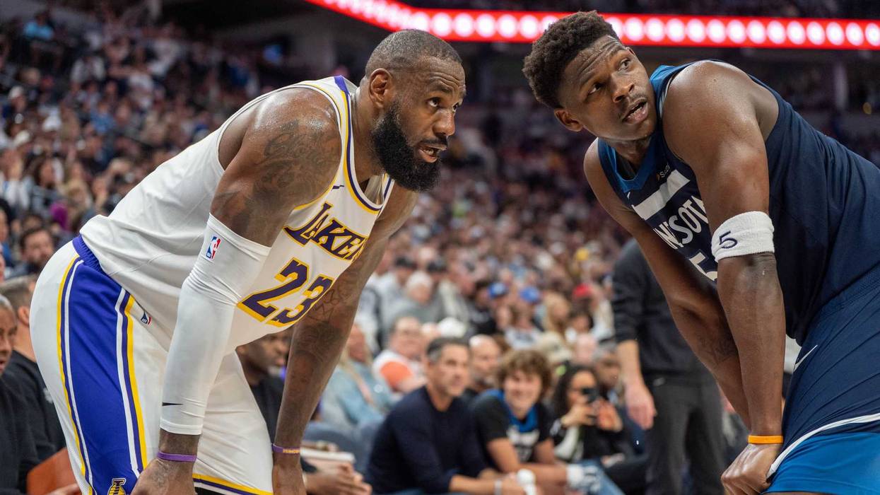 Minnesota Timberwolves guard Anthony Edwards (5) guards Los Angeles Lakers forward LeBron James (23) in the second quarter during game four of first round for the 2025 NBA Playoffs at Target Center.