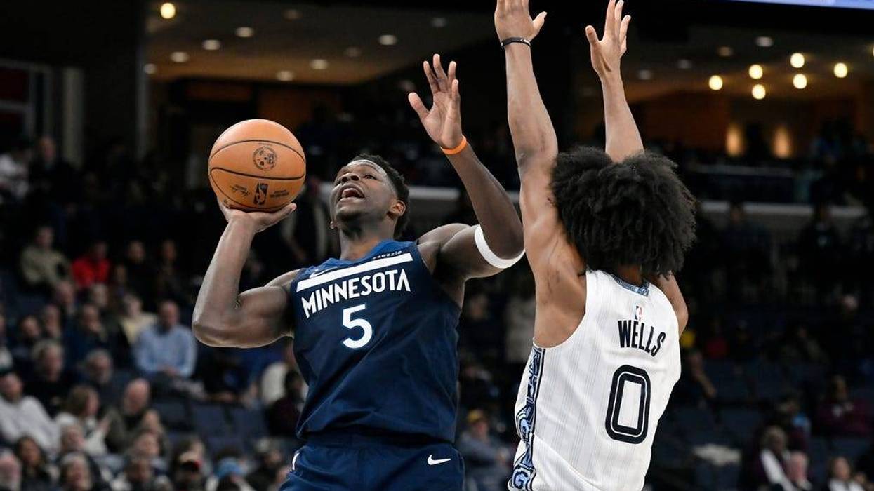 Minnesota Timberwolves guard Anthony Edwards (5) shoots against Memphis Grizzlies forward Jaylen Wells (0) in the first half of an NBA basketball game Monday, Feb. 2, 2026, in Memphis, Tenn.