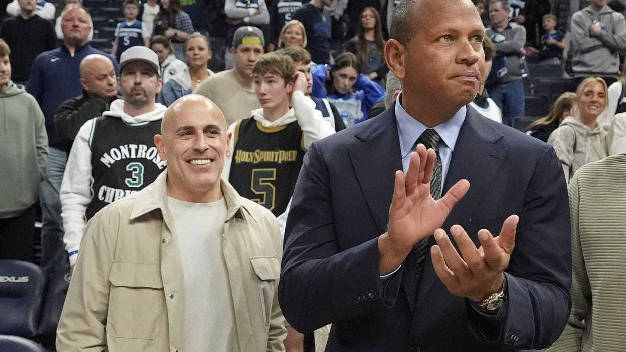 Minnesota Timberwolves minority owners - now majority owners - Marc Lore and Alex Rodriguez celebrate the team's win over the Phoenix Suns at Target Center.