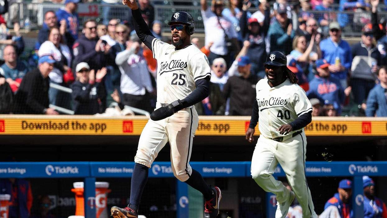 Minnesota Twins center fielder Byron Buxton (25) celebrates after scoring the game winning run on a hit by first baseman Ty France (13) during the tenth inning against the New York Mets at Target Field.