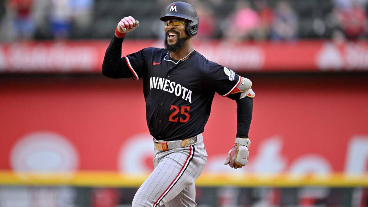 Minnesota Twins center fielder Byron Buxton (25) celebrates as he rounds the bases after hitting a three run home run against the Texas Rangers during the eighth inning at Globe Life Field.