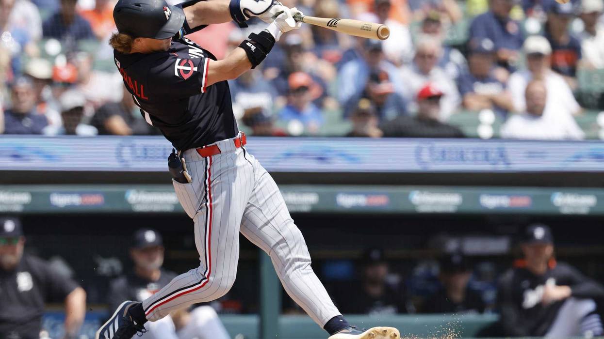 Minnesota Twins second baseman Luke Keaschall (15) hits a two run hits an RBI double in the first inning against the Detroit Tigers at Comerica Park.