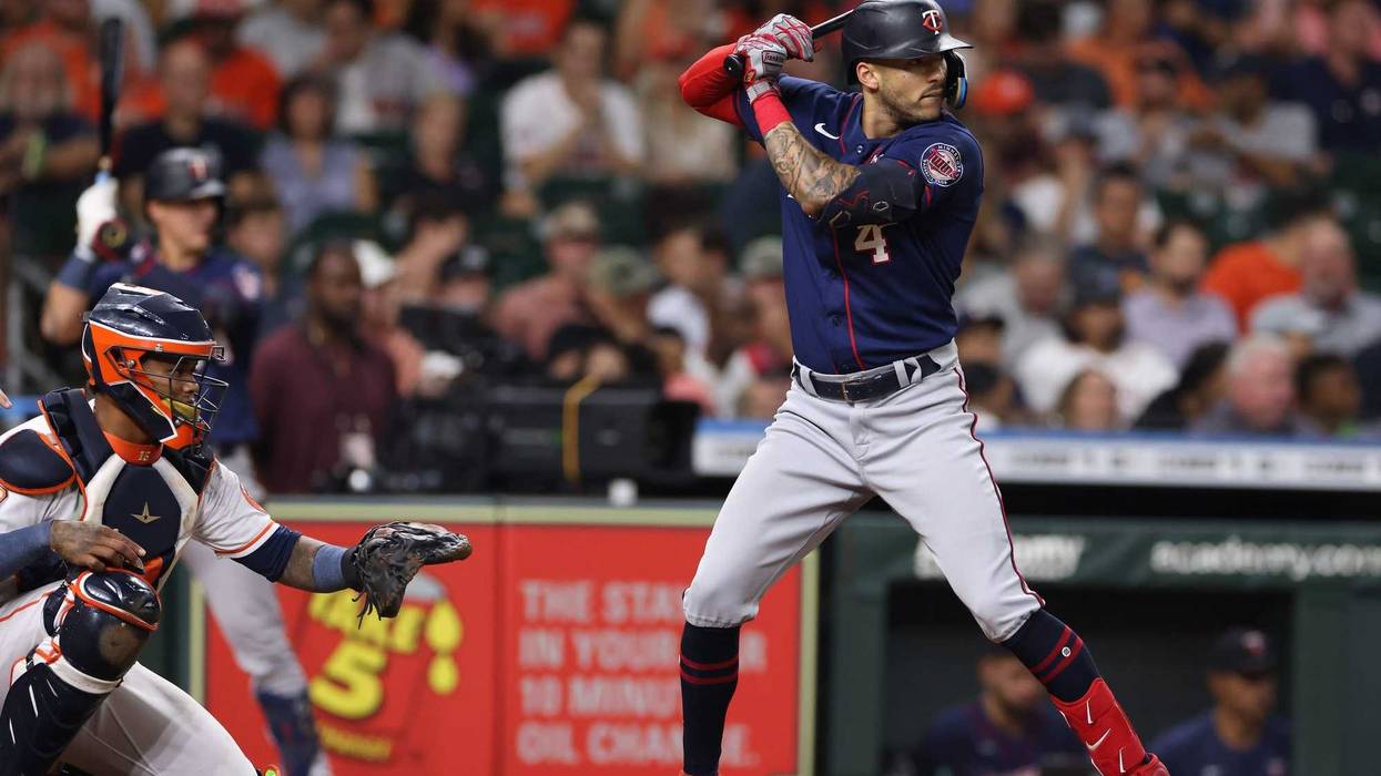 Minnesota Twins shortstop Carlos Correa (4) bats against the Houston Astros at Minute Maid Park in 2022.