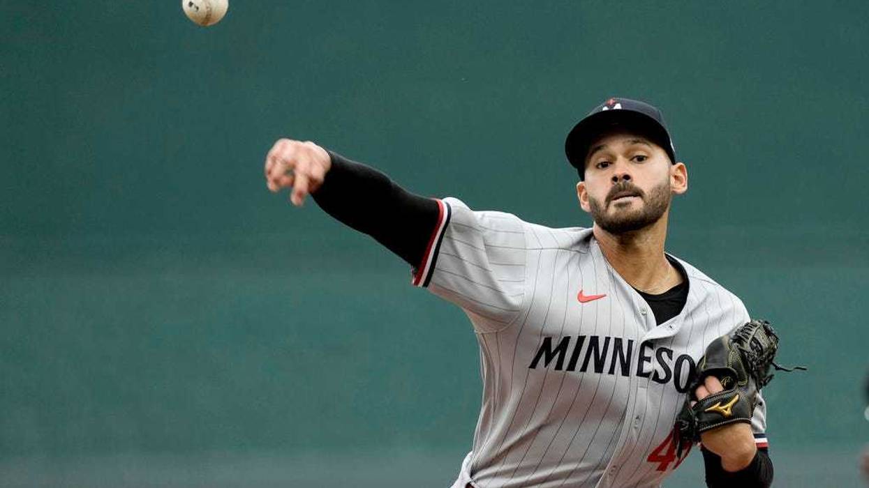 Minnesota Twins starting pitcher Pablo Lopez throws during the first inning of an opening day baseball game against the Minnesota Twins in Kansas City