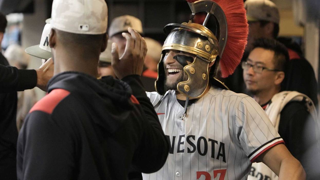Minnesota Twins third base Royce Lewis (23) celebrates in the dugout after hitting a home run against the Milwaukee Brewers in the fourth inning at American Family Field.