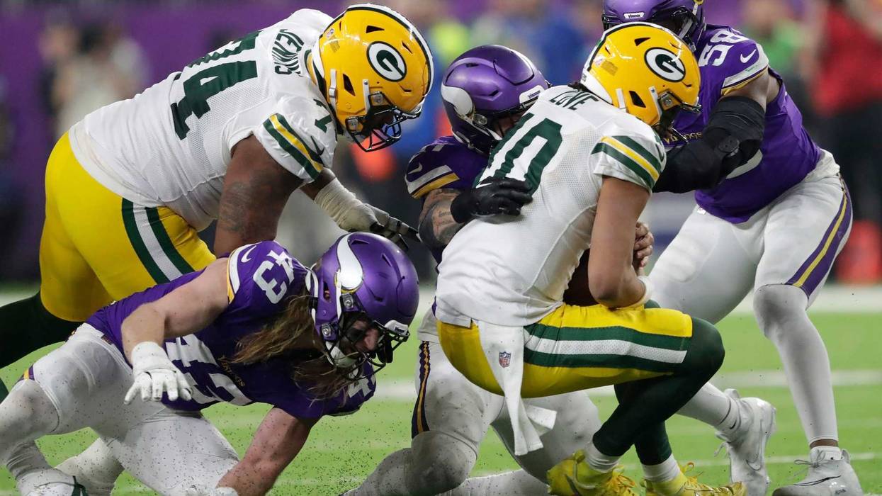 Minnesota Vikings linebacker Blake Cashman (51) sacks Green Bay Packers quarterback Jordan Love (10) in the fourth quarter during their football game Sunday, December 29, 2024, at U.S. Bank Stadium in Minneapolis, Minnesota.