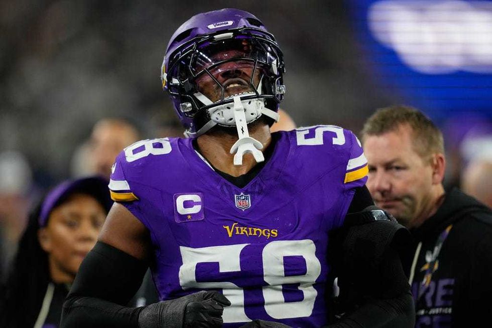 Minnesota Vikings linebacker Jonathan Greenard walks with trainers after an injury during the second half of an NFL football game against the Dallas Cowboys Sunday, Dec. 14, 2025, in Arlington, Texas.
