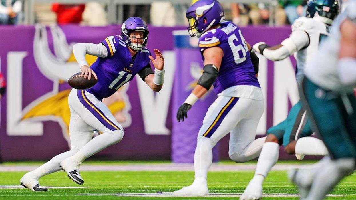 Minnesota Vikings quarterback Carson Wentz (11) runs the ball during the second half against the Philadelphia Eagles at U.S. Bank Stadium.