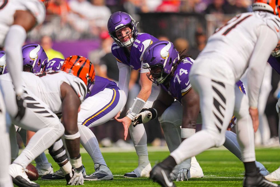 Minnesota Vikings quarterback Carson Wentz (11) under center against the Cincinnati Bengals during their 48-10 win. Head Coach Kevin O