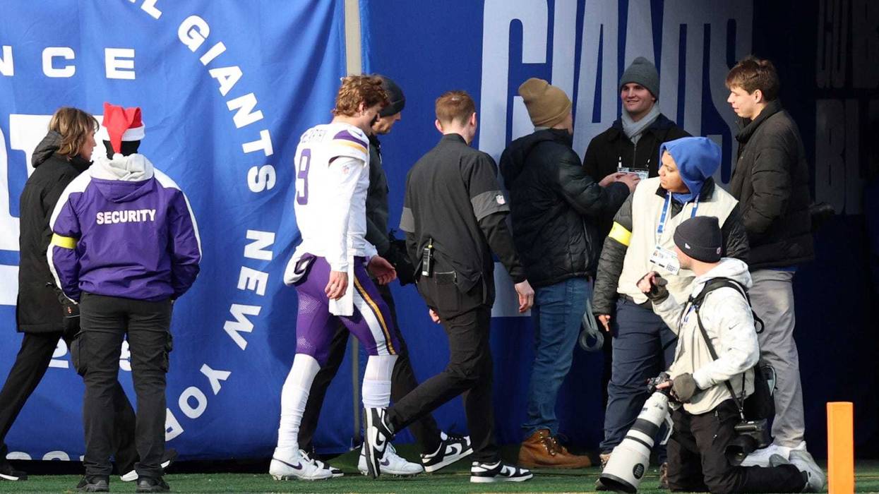 Minnesota Vikings quarterback J.J. McCarthy (9) is taken to the locker room after a hit against the New York Giants during the first half at MetLife Stadium.