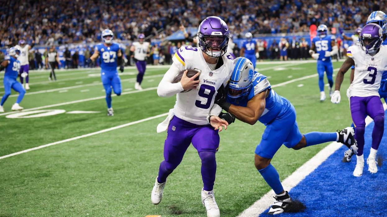 Minnesota Vikings quarterback J.J. McCarthy (9) runs the ball for a touchdown in the third quarter against the Detroit Lions at Ford Field.