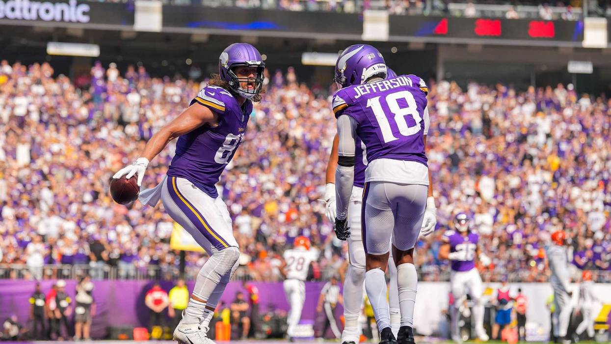 Minnesota Vikings tight end TJ. Hockenson (87) reacts with wide receiver Justin Jefferson (18) after catching a touchdown pass against the Cincinnati Bengals during the second half at U.S. Bank Stadium.