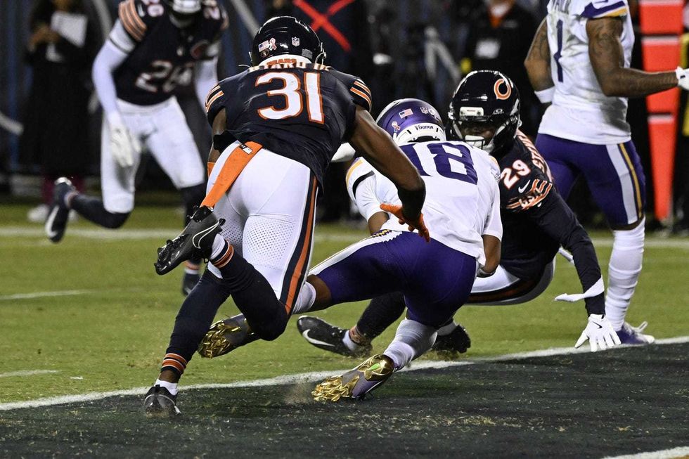 Minnesota Vikings wide receiver Justin Jefferson (18) catches a touchdown pass against Chicago Bears safety Kevin Byard III (31) during the second half at Soldier Field.