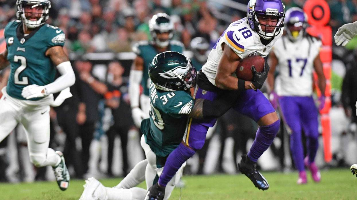 Minnesota Vikings wide receiver Justin Jefferson (18) is tackled by Philadelphia Eagles safety Justin Evans (30) at Lincoln Financial Field.