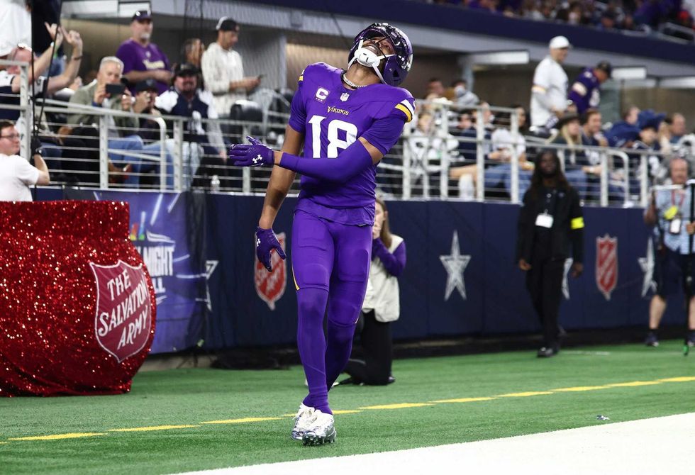 Minnesota Vikings wide receiver Justin Jefferson (18) reacts after a play during the first half against the Dallas Cowboys at AT&T Stadium.