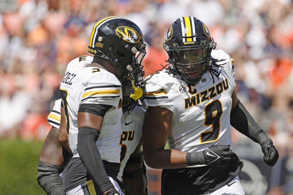 Missouri Tigers defensive lineman Isaiah McGuire (9) celebrates with defensive back Martez Manuel (3) after sacking Auburn Tigers quarterback Robby Ashford (9) during the second quarter at Jordan-Hare Stadium.