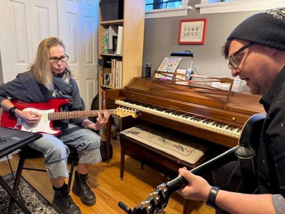 Mo Ulicny plays electric guitar