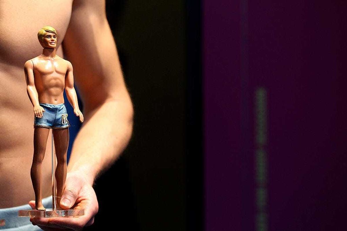 Models dressed the same way as different Ken dolls pose during the press preview day of the International Toy Fair Nuernberg on February 2, 2011 in Nuremberg, Germany.