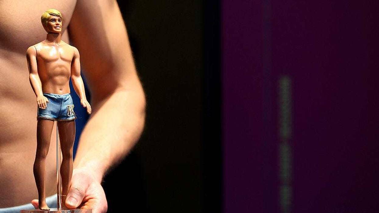 Models dressed the same way as different Ken dolls pose during the press preview day of the International Toy Fair Nuernberg on February 2, 2011 in Nuremberg, Germany.