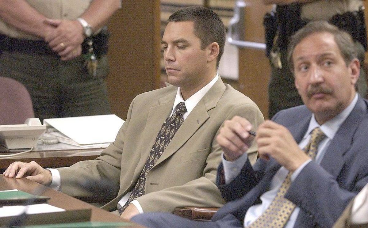 MODESTO, CA - JUNE 6: Murder suspect Scott Peterson (L) sits with his attorney Mark Garagos (R) in Stanislaus Superior Courtroom #2 at the beginning of the discussion over releasing autopsy reports June 6, 2003 in Modesto, California. Peterson, 30-years-old, may face the death penalty if convicted on charges of murdering his wife and unborn son.