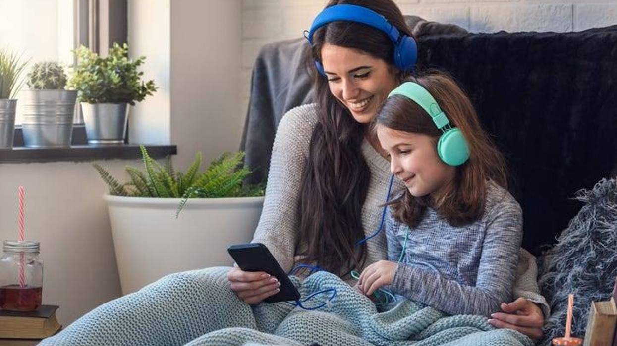 Mom And Daughter Listening To Music