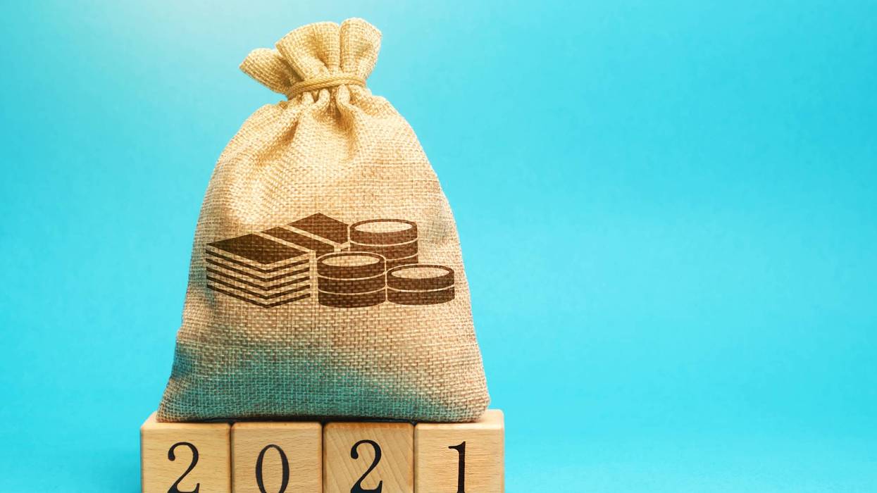 Money bag and wooden blocks 2021