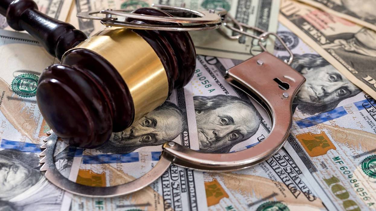 Money, gavel and handcuffs