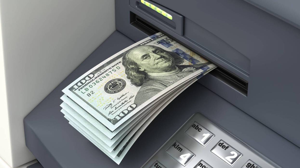 Money sticking out of ATM