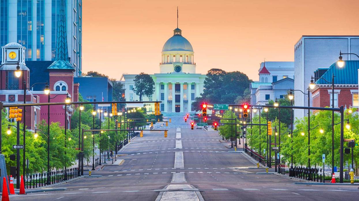 Montgomery, Alabama, USA with the State Capitol and cityscape at dawn.